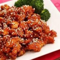 Sesame Chicken · Crispy light batter-fried chicken coated in house sauce sprinkle with sesame seed bedding wi...