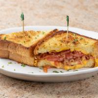 Loaded Grilled Cheese · Bacon, tomato, and American on grilled buttery thick cut toast. Served with French fries.