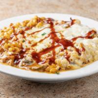 Piggy Mac · Creamy cheese sauce with pulled pork, bacon, and jalapeño topped with cheddar, mozzarella, a...