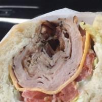 Turkey Or Roast Beef Club · with Swiss Cheese, Bacon, Lettuce, Tomato & Mayo