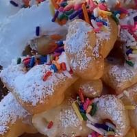 Ann Marie’S Funnel Cake Bites  · Funnel Cake Bites 
Rainbow Sprinkles , Vanilla Whipped Cream & Caramel Sauce