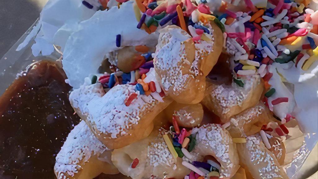 Ann Marie’S Funnel Cake Bites  · Funnel Cake Bites 
Rainbow Sprinkles , Vanilla Whipped Cream & Caramel Sauce