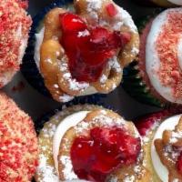 Half Dozen Strawberry Crunch & Funnel Cake Cupcakes  · Strawberry Crunch Cupcakes & Vanilla Cupcakes With Funnel Cake topping & strawberry sauce