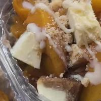 Ann Marie’S Peach Cobbler Cheesecake Salad · Freshly Made Peach Cobbler Topping Cheesecake 
White Chocolate Drizzle