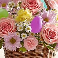 Easter Basket Arrangement  · Our beautiful wicker basket is filled with the colors of Spring, including roses, daisy poms...