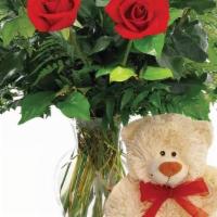 Love You Much Arrangements  · Let your love bloom with this beautiful hand arranged gift of a half dozen red roses with a ...