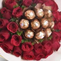 Rose Bouquet With Ferrero Rocher   Arrangement  · Roses and chocolate- ...

10 chocolates per Dz roses.