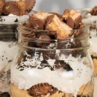 Supreme Peanut Butter Reese’S Cheesecake  Jar  · Loaded brownie bites , peanut butter , cheesecake & candy Topping