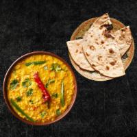 Daal Yellow Mellow (Vegan) & Tandoori Roti (Vegan) · Yellow lentils, slow cooked to perfection and tempered with cumin, garlic and chilies, serve...