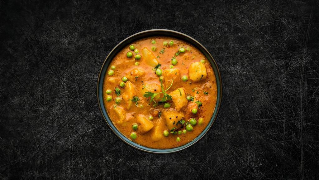 Soulful Peas & Potatoes (Vegan) · Peas and potatoes, simmered to perfection in an onion, tomato and Indian whole spice curry, served with a side of our long grain basmati rice