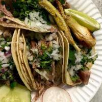 Tacos Mexicanos · Cilantro and cebolla.