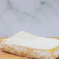 Lemon Bar · Classic sweet and tart lemon bar topped with powdered sugar