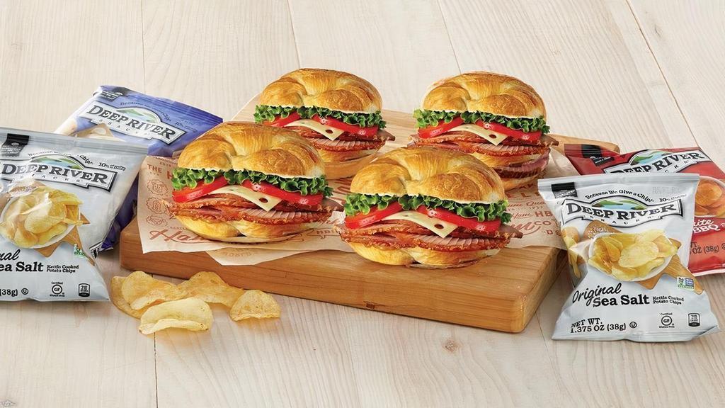 Ham Classic Sandwich 4-Pack · Perfect for folks on-the-go! Try our new Ham Classic Sandwich 4-Pack for lunch or dinner. This sandwich pack includes four (4) Honey Baked Ham Classic Sandwiches. Each sandwich comes with a bag of Deep River Sea Salt Kettle-Cooked Potato Chips. Serves 4.