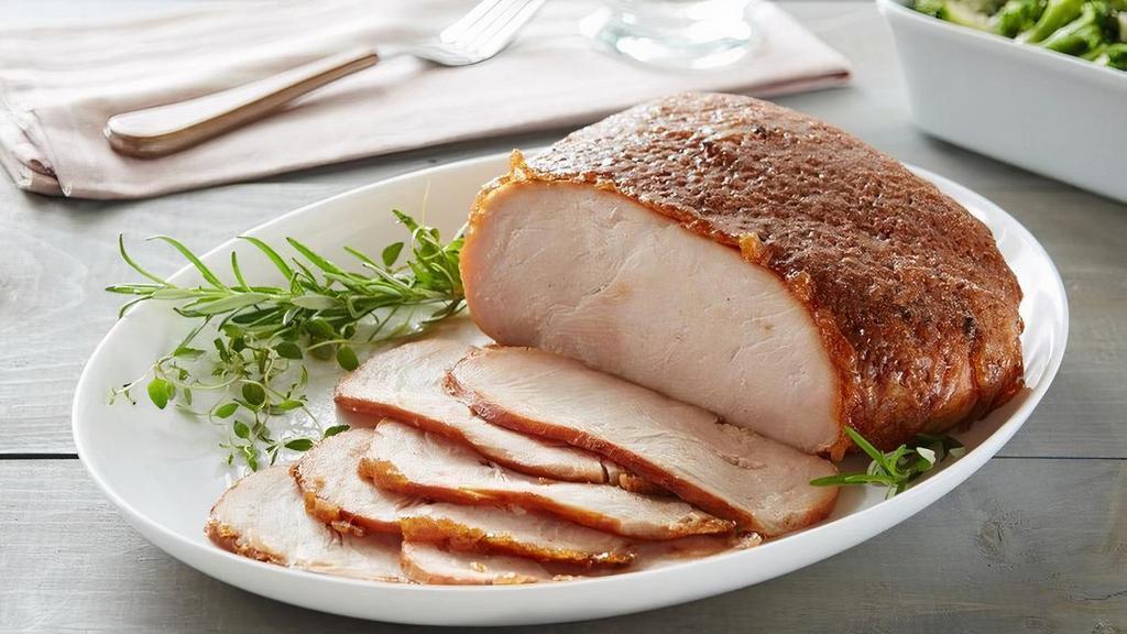 Honeybaked Roasted Turkey Breast · Slow-roasted and seasoned with the perfect blend of herbs and spices for a juicy, tender and delicious Roasted Turkey experience. HoneyBaked has changed boring, predictable turkey. You may think you've had turkey before, but if you've never had Honey Baked Turkey Breast, you have a whole new experience in store. Turkey has never tasted so good! Slow-roasted and perfectly seasoned for the most juicy, tender and delicious taste infused into every bite. It's indulgence as its best - everyone loves it. We think you'll agree that this turkey is like no other - and is the World's Best Turkey. Premium 100% white breast meat and hand-crafted in store with our sweet crunchy glaze. Fully cooked, pre-sliced and ready to serve. 2.5 - 3 lbs. Serves 6-8