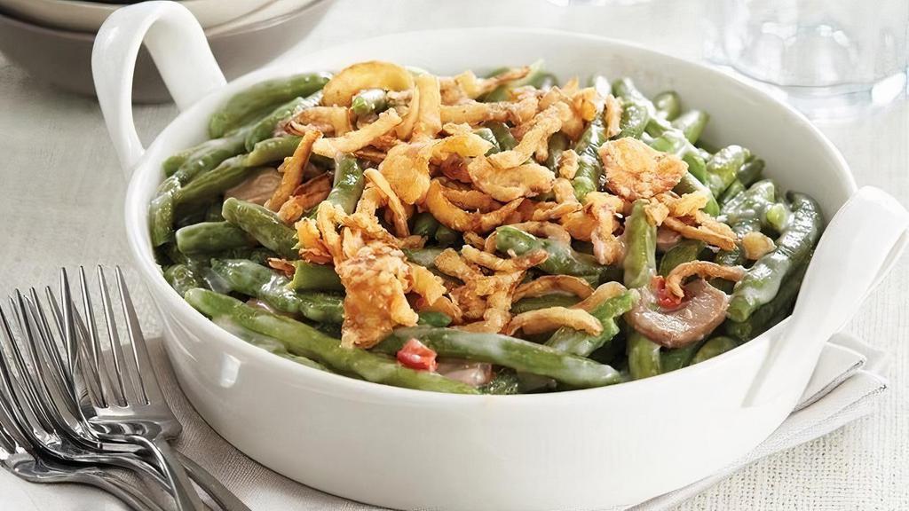 Green Bean Casserole · Farm-fresh green beans with a healthy dose of out-of-this-world flavor makes this dish welcome at any table. It all starts with fine green beans - young, tender and at the peak of flavor. These morsels are mixed with mushrooms and red peppers, tossed in a cream sauce, topped with crispy fried onions. Side arrives frozen. Just Heat and Serve.