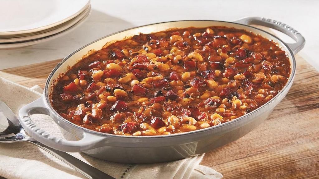 Honeybaked Beans · A blend of Great Northern Beans and Black-Eyed Peas with Honey Baked Ham in a Zesty Sauce. Serves 4-6. Side arrives frozen. Just heat and serve.