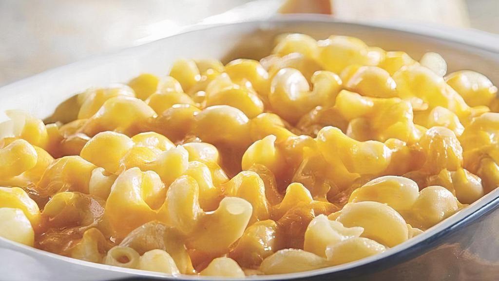 Double Cheddar Macaroni And Cheese · This sensational side combines tender corkscrew pasta tossed in creamy white cheddar cheese sauce, topped with cheddar cheese. Kids love it as well as adults. It makes a delicious accompaniment to the Honey Baked Ham as well as our many other specialty meats. It's as good as homemade and a lot less work. Side arrives frozen. Just Heat and Serve.