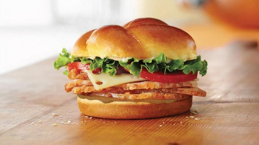 Turkey Classic · Choice of smoked or roasted Honey Baked Turkey Breast topped with Swiss cheese, lettuce, tomato, Duke’s® mayonnaise, and hickory honey mustard on a baker’s roll. 560-590 cal.