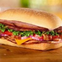 Bbq Smoked Stacker Sandwich · Honey Baked Ham, bacon, cheddar cheese, lettuce, tomato, red onion and smoky BBQ sauce on ci...