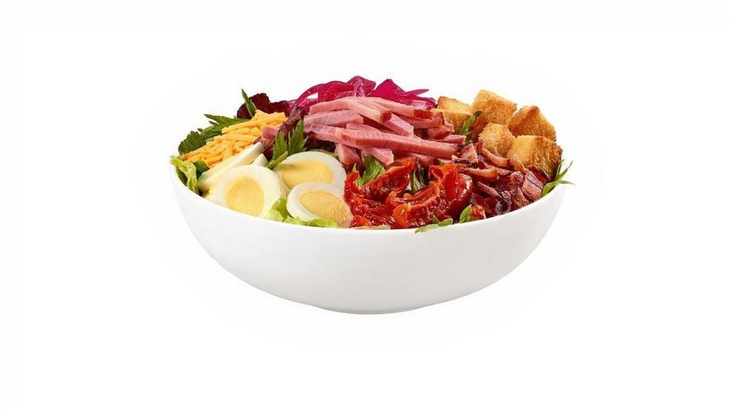 Cobb Salad  · Honey Baked Ham, bacon, cheddar cheese, roasted tomatoes, pickled red onions, hard boiled egg, and cornbread croutons on a blend of green leaf & spring mix