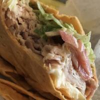 Downtown Wrap · Smoked turkey and Brie cheese, lettuce, tomatoes, and honey mustard.