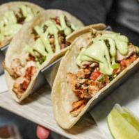 Street Tacos · onions, cilantro, jalapeno relish, cabbage slaw, avocado creme fraiche, corn tortilla