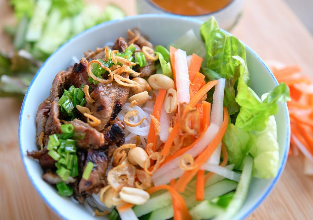 Bbq Pork Noodle Bowl · Bbq pork marinated with lemongrass & vietnamese fish sauce, vermicelli noodle, basil, mint, cucumber, pickle carrots, peanuts.