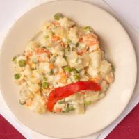 Ensalada Rusa · Russian salad: potatoes, green peas, carrots in a mayonnaise dressing.