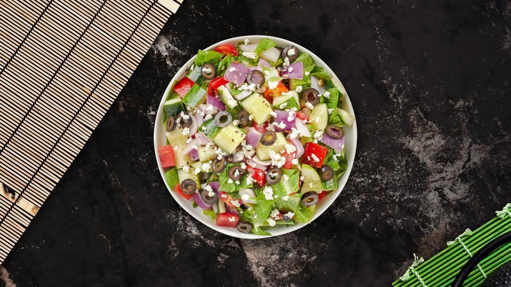 Greek Salad · Romaine lettuce, feta cheese, tomato, cucumbers, and black olives tossed in oil and vinegar dressing.