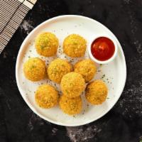 Mac & Cheese Balls · (Vegetarian) Bite-size clumps of mac and cheese breaded and fried until golden brown. (10 pi...