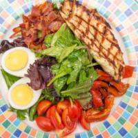Cobb Salad · With chicken breast, roasted peppers, eggs, bacon, blue cheese, and tomato.