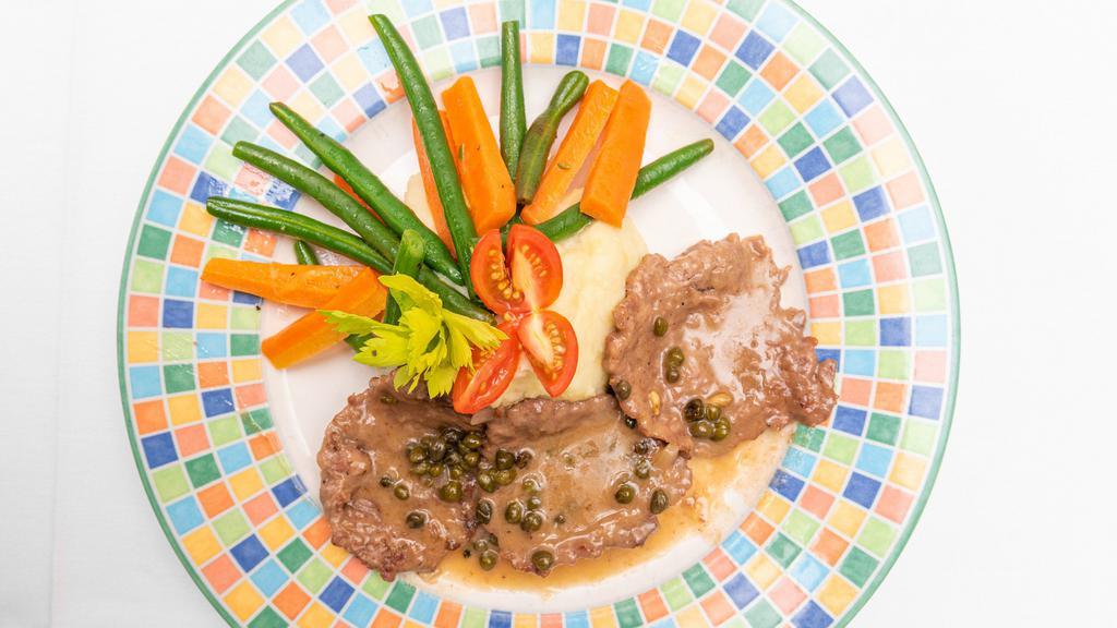 Veal Picatta · With potato and vegetable.