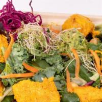 Chicken Tikka Salad With Avocado · Served with Avocado, Extra Virgin Olive Oil, Pomegranate Molasses, Kale, Lettuce, Carrot, Gi...