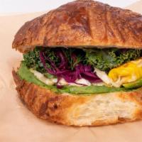 Croissant Sandwich · Comes with organic boiled or fried egg, avocado, mozzarella cheese, raw greens and green hum...