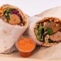 Meatball Burrito · Includes Turkish rice and chickpeas , green hummus, veggies, greens and homemade hot sauce.