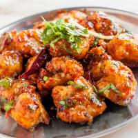 Cauliflower Lasuni · Crispy cauliflower florets tossed in a tomato garlic sauce with bell peppers.