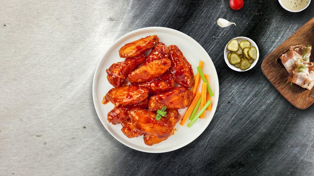 Blazing Buffalo Wings · Our famous wings fried until perfectly golden and tossed in mild or hot buffalo sauce. Served with your choice of sauce and veggies