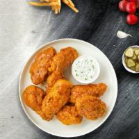 It Takes Two To Mango Habanero Wings · Our famous wings fried until perfectly golden and tossed in mango habanero sauce. Served wit...