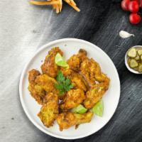 John Lemon Pepper Wings · Our famous wings fried until perfectly golden and tossed in lemon pepper sauce. Served with ...