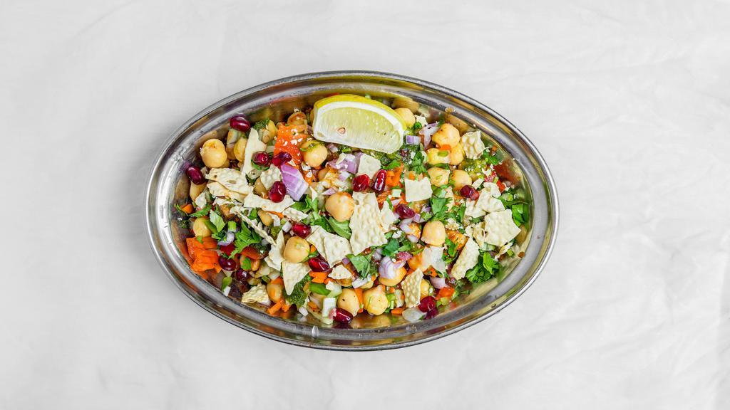 Chana Chaat · Well seasoned boiled chickpeas chaat tossed with onion, cucumber, carrots and bell peppers with chaat masala, cilantro and a crushed poppadum
(OIL FREE, GLUTEN FREE,DAIRY FREE, VEGAN)