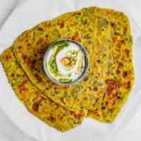 Aaloo Paratha  2 Pc  · Whole Wheat flatbread filled with spicy boiled mashed potato. Best enjoyed with butter and c...