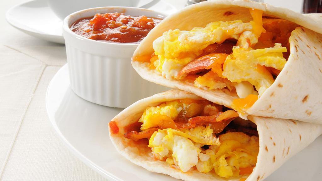 Sausage Breakfast Burrito · Scrambled eggs, sausage, choice of veggies wrapped in a warm flour tortilla.