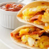 Breakfast Burrito · Scrambled eggs, choice of veggies wrapped in a warm flour tortilla.