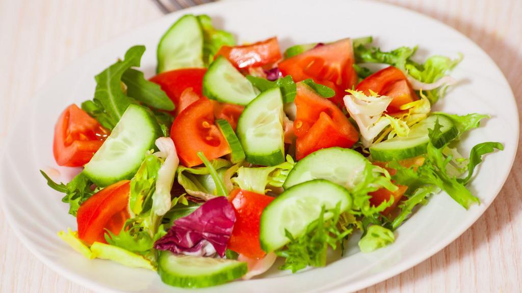 Garden Salad · Diced tomatoes, cucumbers, carrots, and broccoli tossed with mixed greens.