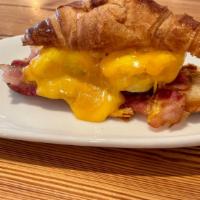 Bacon, Egg And Cheddar Croissant · All butter croissant with baked egg, bacon and cheddar cheese.  This item is not available f...