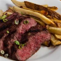 Steak Frites · Premium ribeye steak and fries.