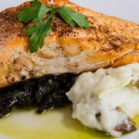 Sanford Salmon · Blackened salmon served with sauteed kale.