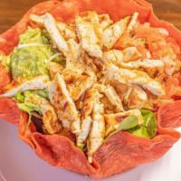 Mexican Taco Salad · Crispy tomato tortilla filled with your choice of protein, spring mix, pico de gallo, guacam...