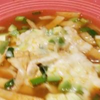 Chicken Tortilla Soup · Tender chunks of grilled chicken, avocado green onion, crispy tortilla strips and melted Mon...