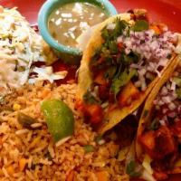 Tacos Al Pastor Dinner · Melted jack cheese, caramelized onions, mixed cabbage, braised pork, pineapple relish, pico ...